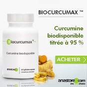 Boîte de gélules de curcuma titré à 95 % en curcumine biodisponible. Racines et gélules de curcuma à côté de la boîte.